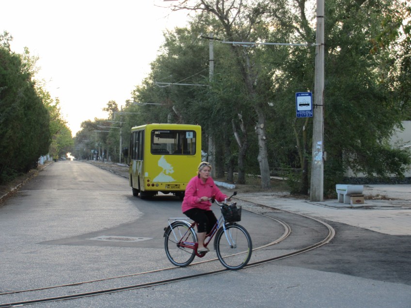 Quiet street, cyclist and trolley car