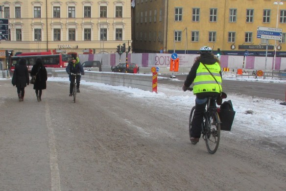 Cyclists on snow Slussen Stockholm