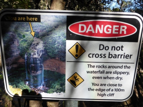 Blue mountain waterfall danger sign
