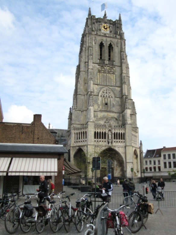 I fulfilled a small Belgian ambition yesterday. Ever since I went cycling the Limburg last summer and discovered the beautiful region of the Haspengouw I have been looking forward to going back in spring to see the blossom season. We almost left it too late because the season is regarded as April but the Mayday public holiday was a last chance to drift back towards St. Truiden and Tongeren and catch the final apple blossoms. This is a beautiful area of Belgium, rolling hills giving wide open landscapes, sleepy villages and historic towns. Once again we said to ourselves “why do so few people know about this?” Then of course we corrected ourselves and selfishly agreed “yes, but good for us that they don’t” We weren’t cycling this time, this was a day for walking with the dog, his advancing years and arthritic hips mean that his days of running beside the bikes and jumping in and out of trailers are over but he can still show puppy-like enthusiasm for a walk full of new smells. However cycling was never far away because the Limburg Bicycle Paradise was booming, everywhere we went bikes seemed to be the dominant source of customers for the bars and cafes. Lots of e-bikes which are now breaking through in Flanders in a big way, clearly allowing many more people to join their friends and family in small touring groups which was lovely to see too. I can see that this is going to be a long term favourite destination for our days out and short breaks.